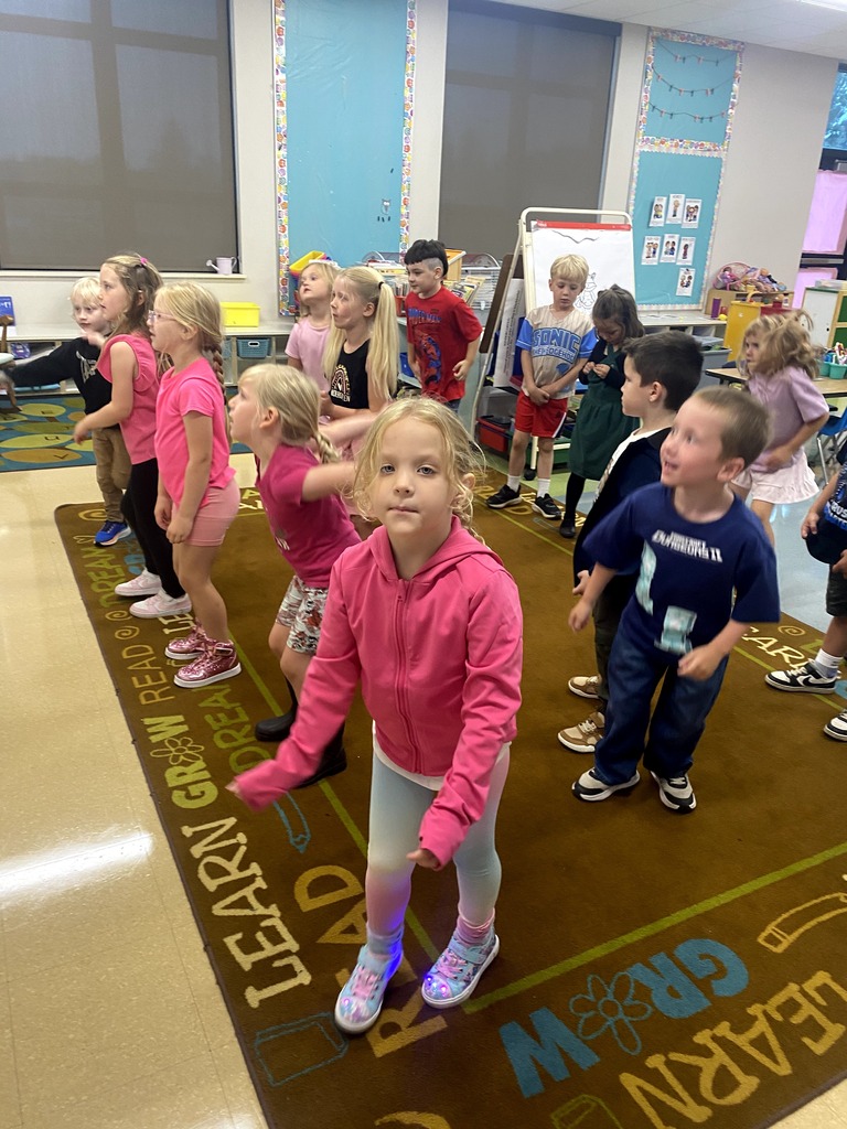 Kindergarten students dancing on the first day of school