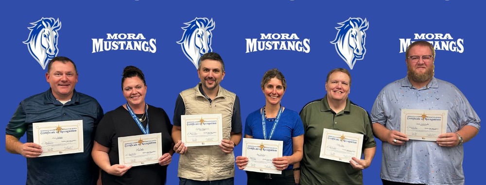 Photo of all Mora School Board Members: Left to Right: Ken Mattson, Jill Koch, Matt Heggernes, Amy Schultz, Scott Moe, Dakota Helmbrecht