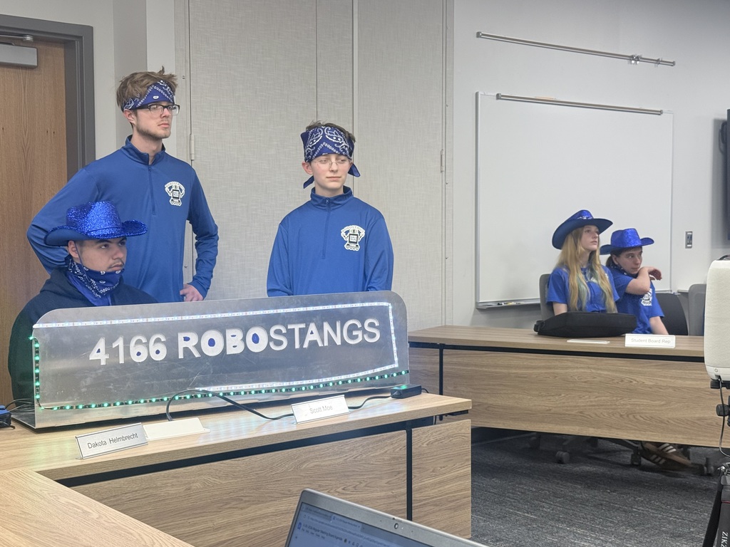 Robotics team presenting at the board meeting