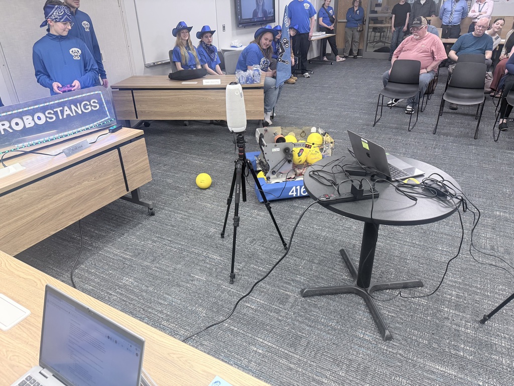 Robotics team presenting at the board meeting