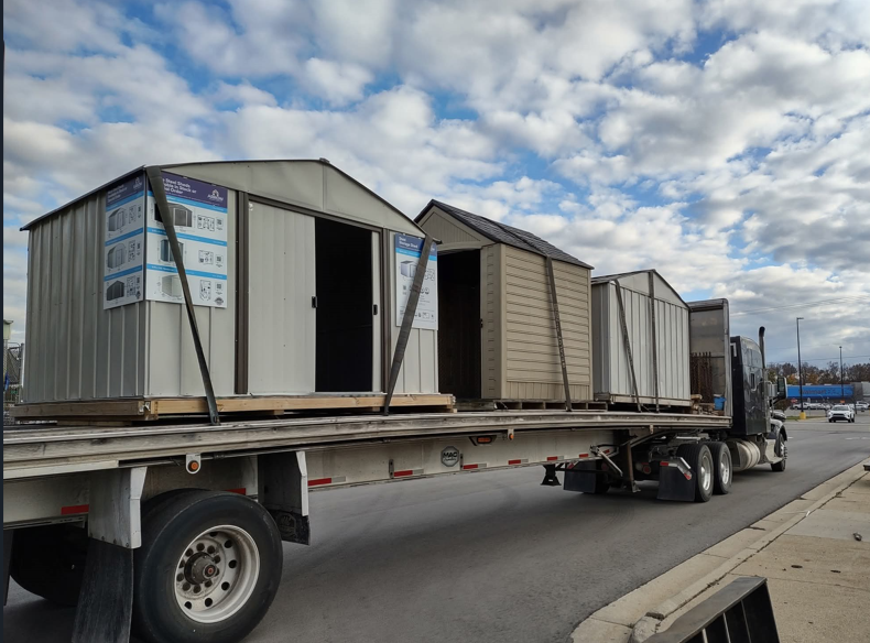 Three sheds on one semi truck
