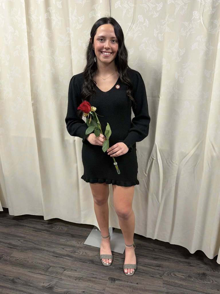 student holding a rose