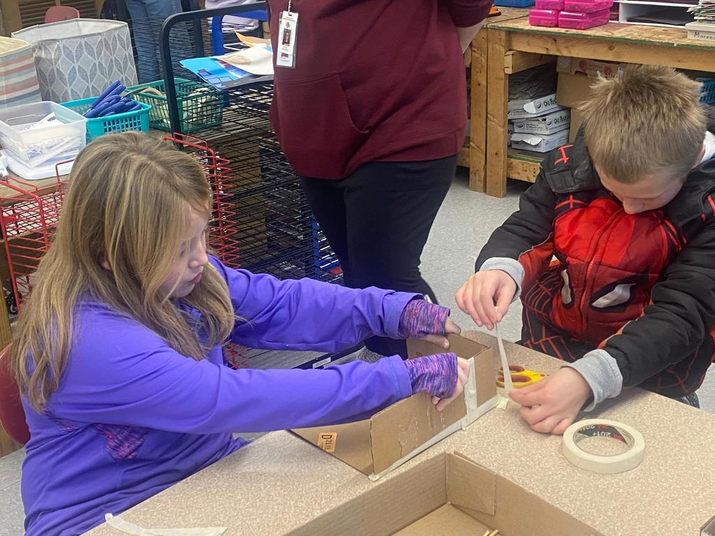 two students building a wagon