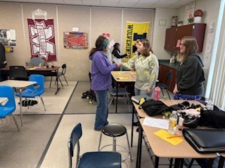 two students shaking hands