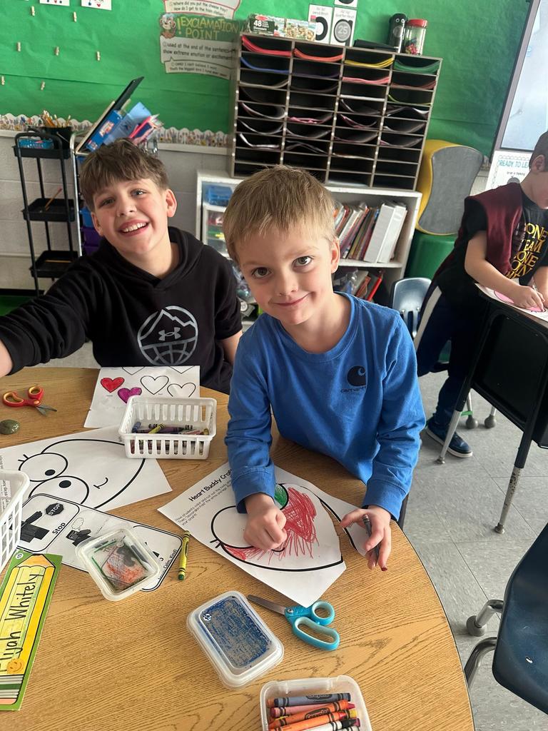 two boys working on class project