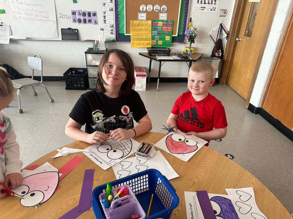 girl and boy working on class project