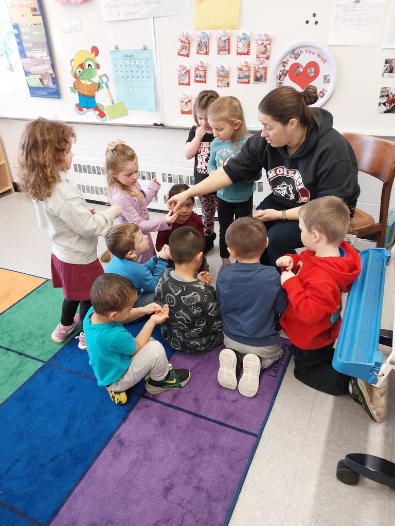 a group of students smelling spices