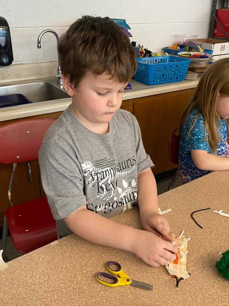 students testing out the sleds they engineered during steam class.