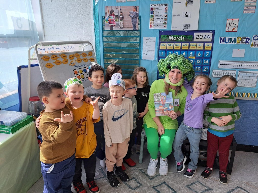 teacher reading dressed up as broccoli