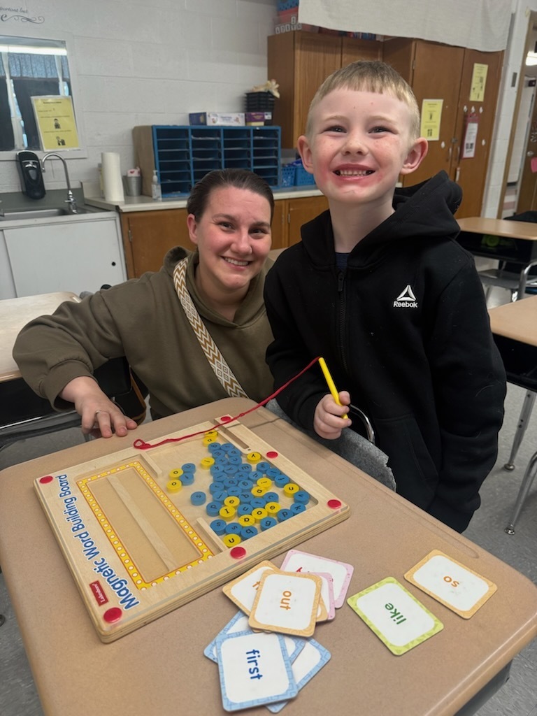 mother and son doing a literacy game