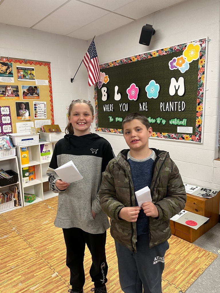 two students smiling for the camera