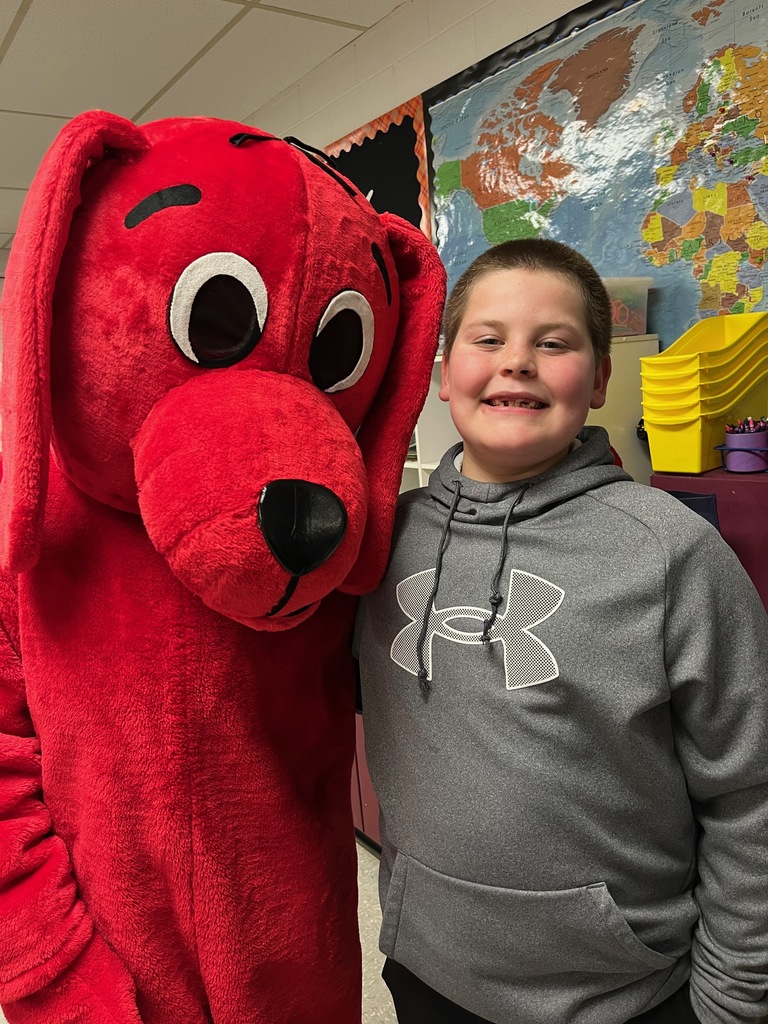 clifford the big red dog with a boy student