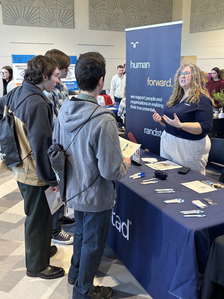 student at a booth at the align career fair