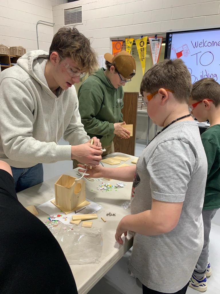 students building a birdhouse