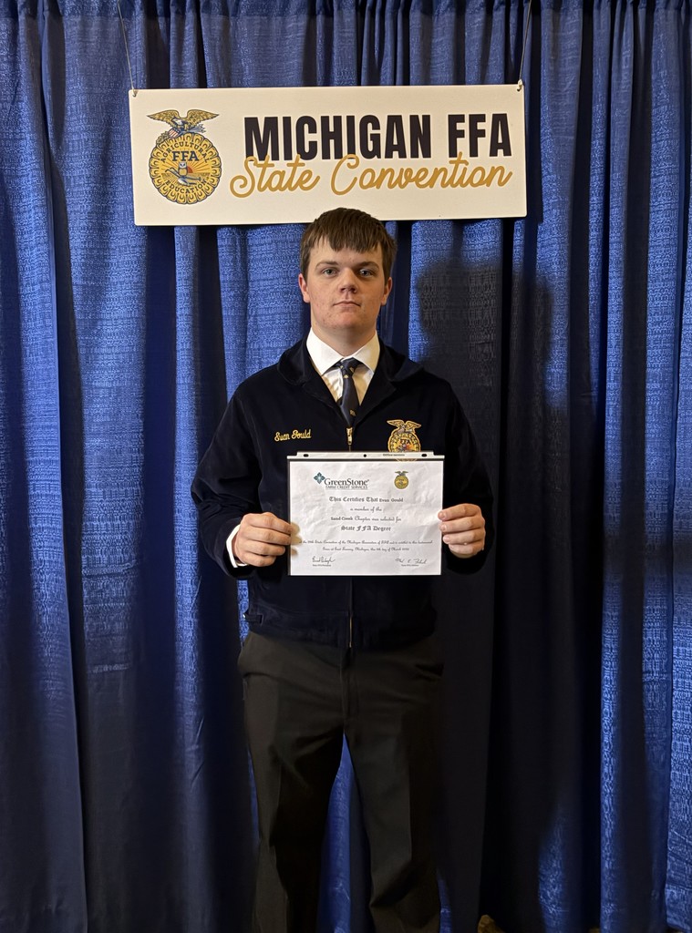 student holding a ffa certificate