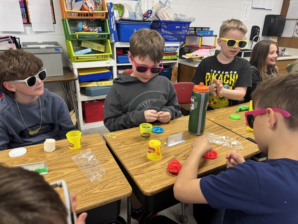 students working with playdough to see how a welder welds.