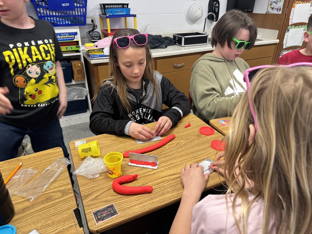 students working with playdough to see how a welder welds.