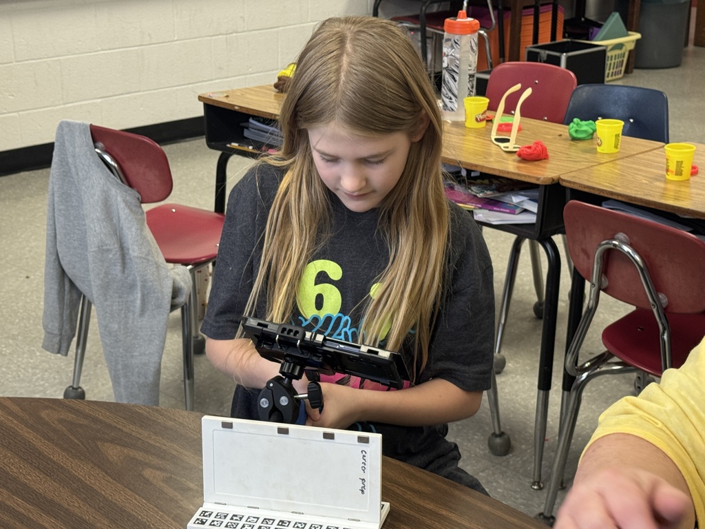 students working with playdough to see how a welder welds.