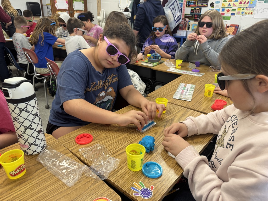 students working with playdough to see how a welder welds.