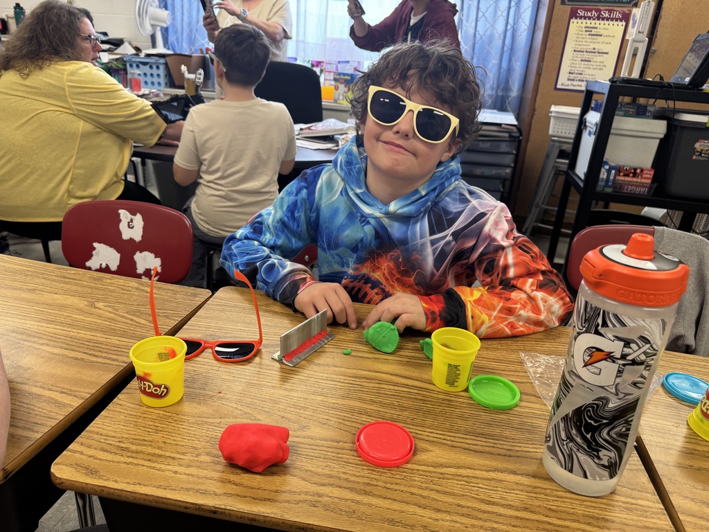 students working with playdough to see how a welder welds.