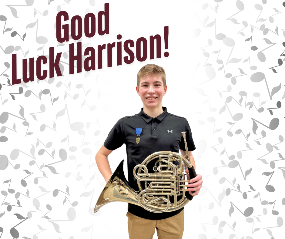 student holding horn instrument