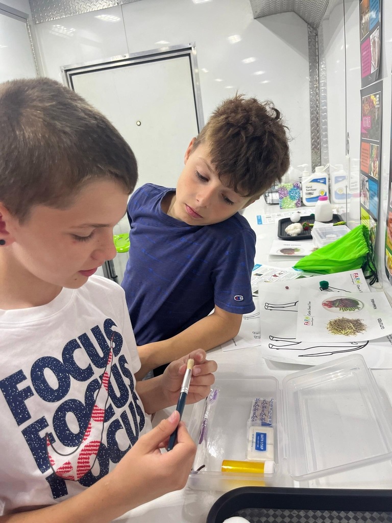 students doing activities in the Farm Science Lab.