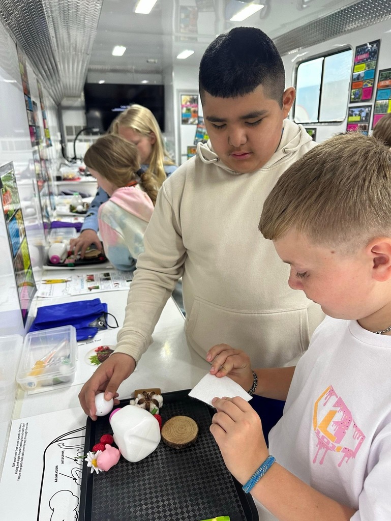 students doing activities in the Farm Science Lab.