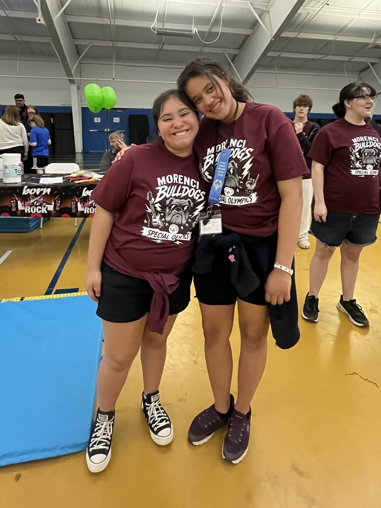 Two students posing for picture.
