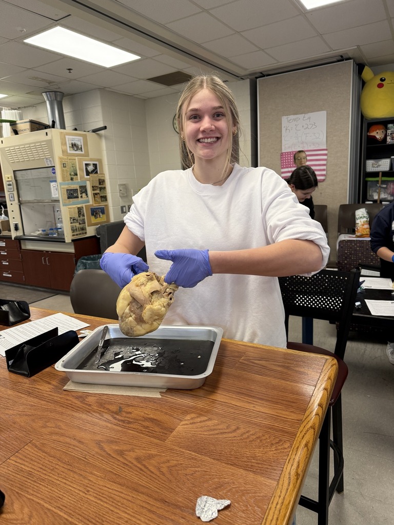 student holding a heart