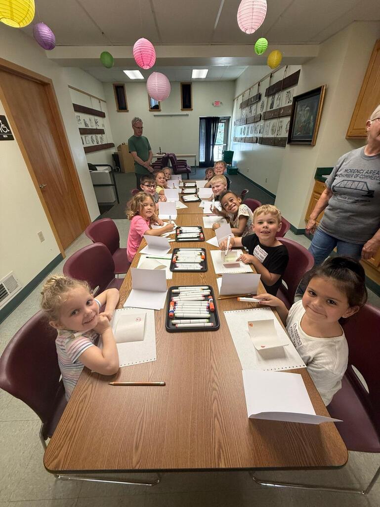 students at the Stair District Library learning about the summer reading program.