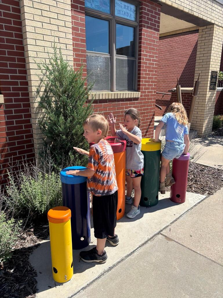 students at the Stair District Library learning about the summer reading program.