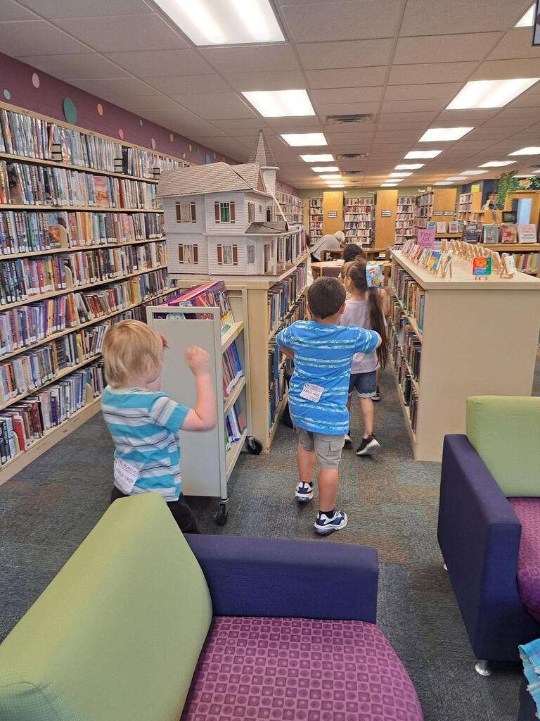 students at the Stair District Library learning about the summer reading program.