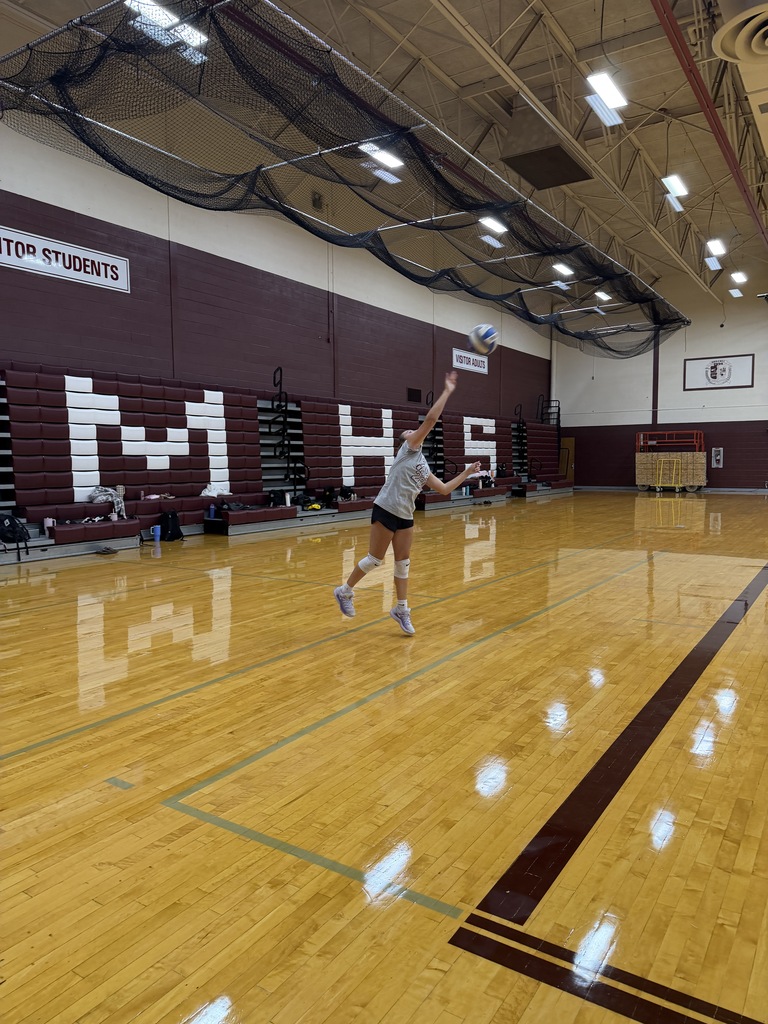volleyball payer serving the ball