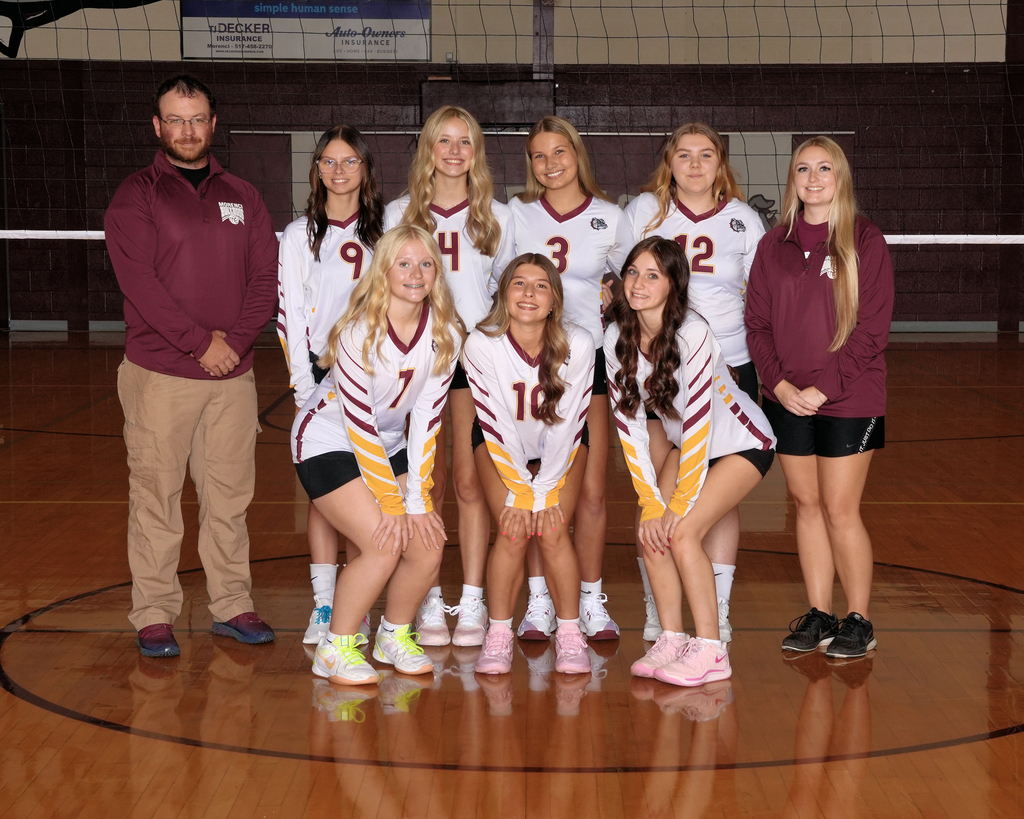 JV volleyball players posint for pictures