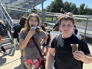students eating ice cream sandwiches