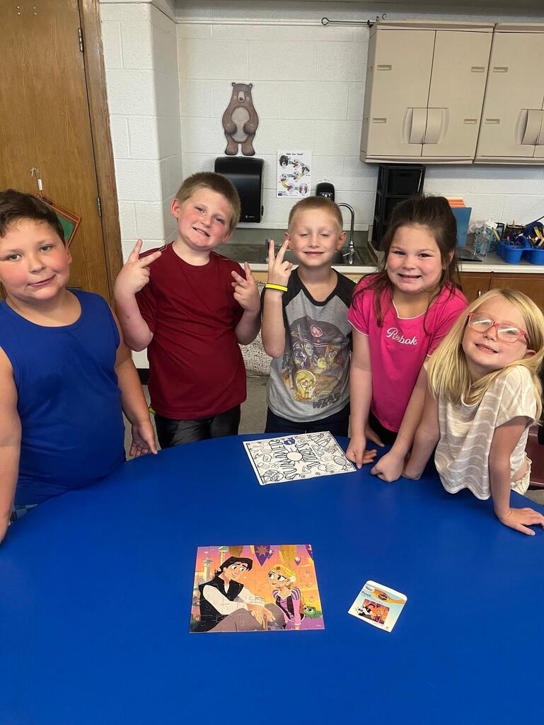 students working on putting a puzzle together