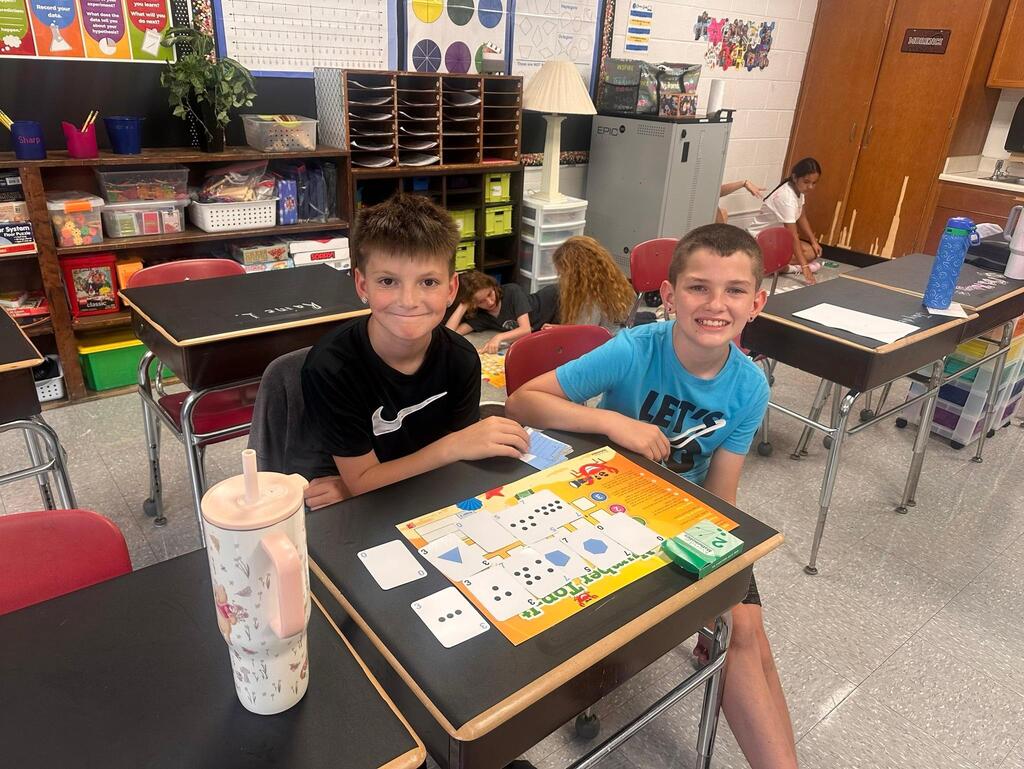 two students playing a math game
