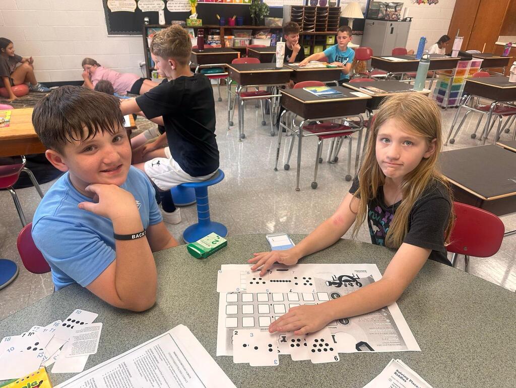 two students playing a math game