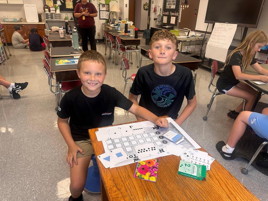 two students playing a math game