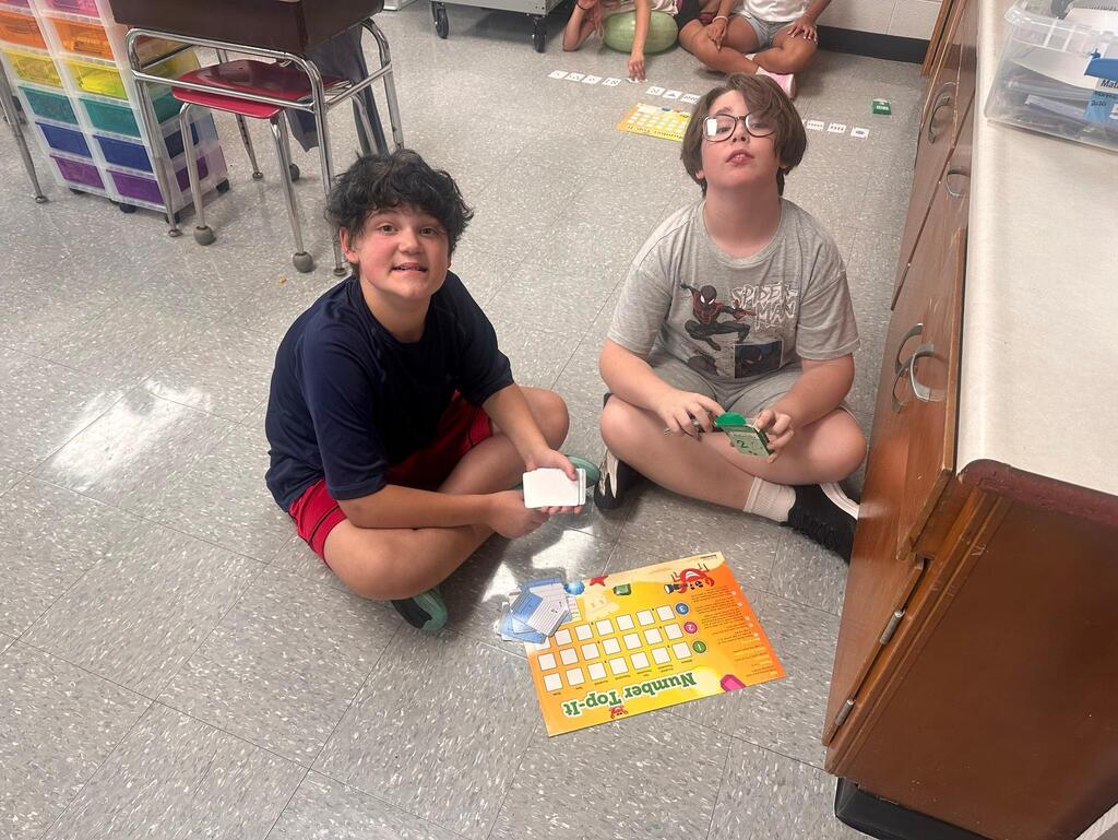 two students playing a math game