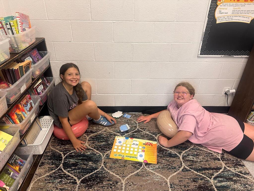 two students playing a math game