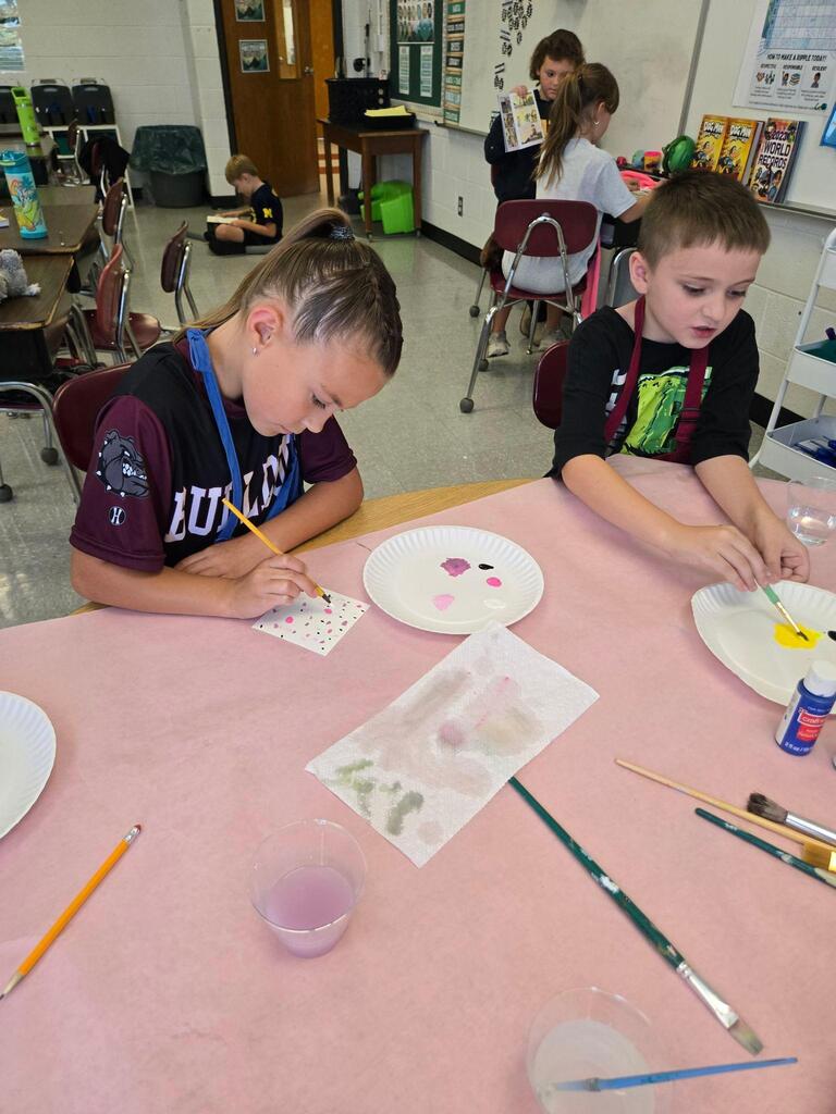 two students working on a art project
