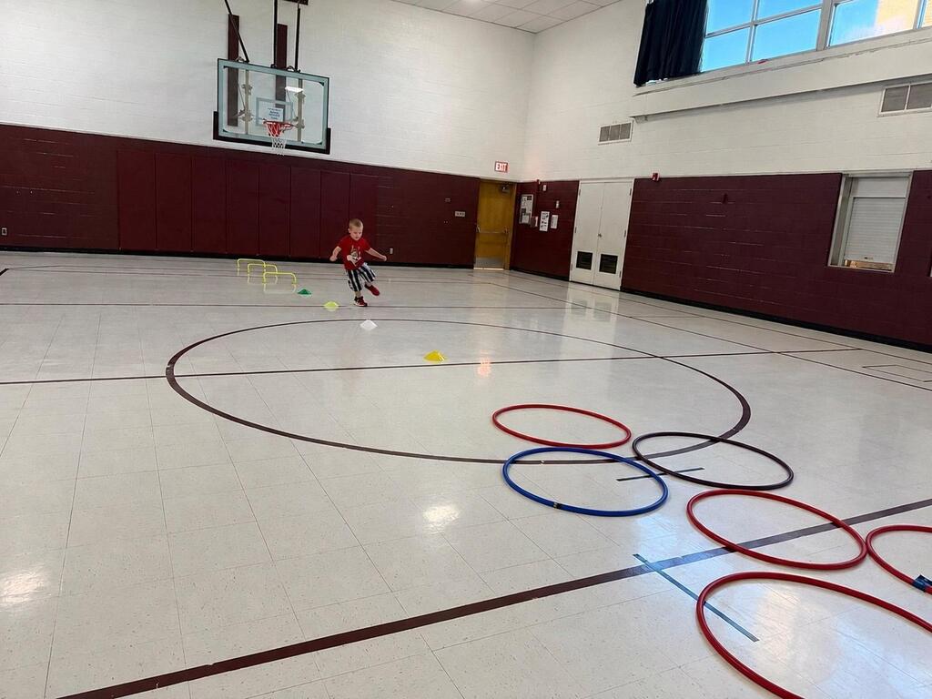 students playing game in gym class