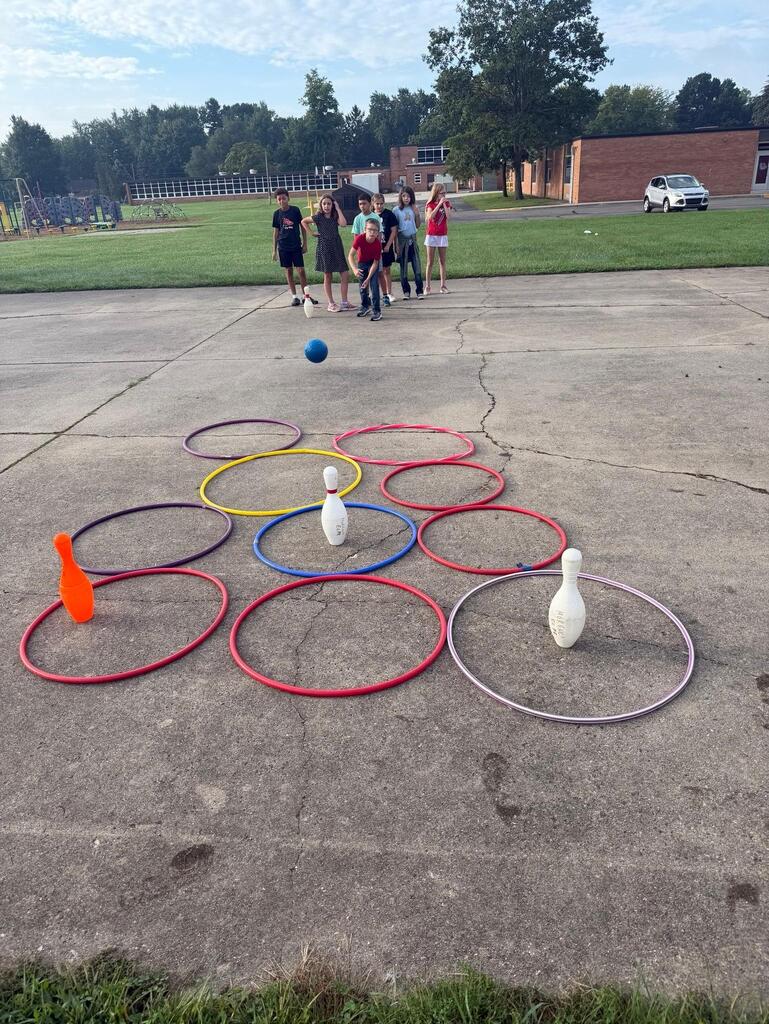 students playing game in gym class