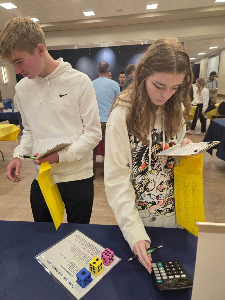 two students at a booth