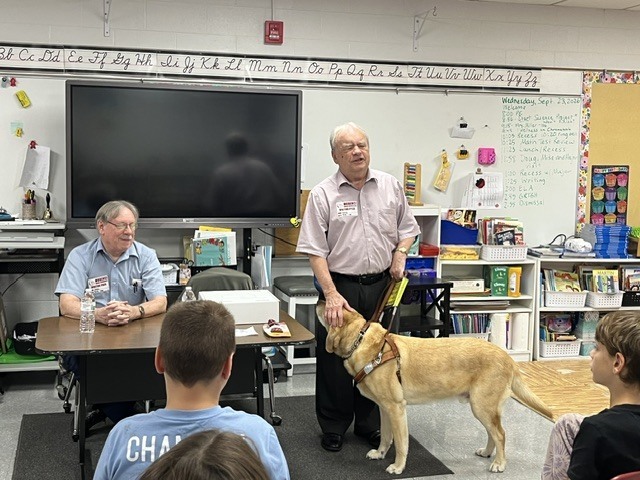 blind man with his service dog