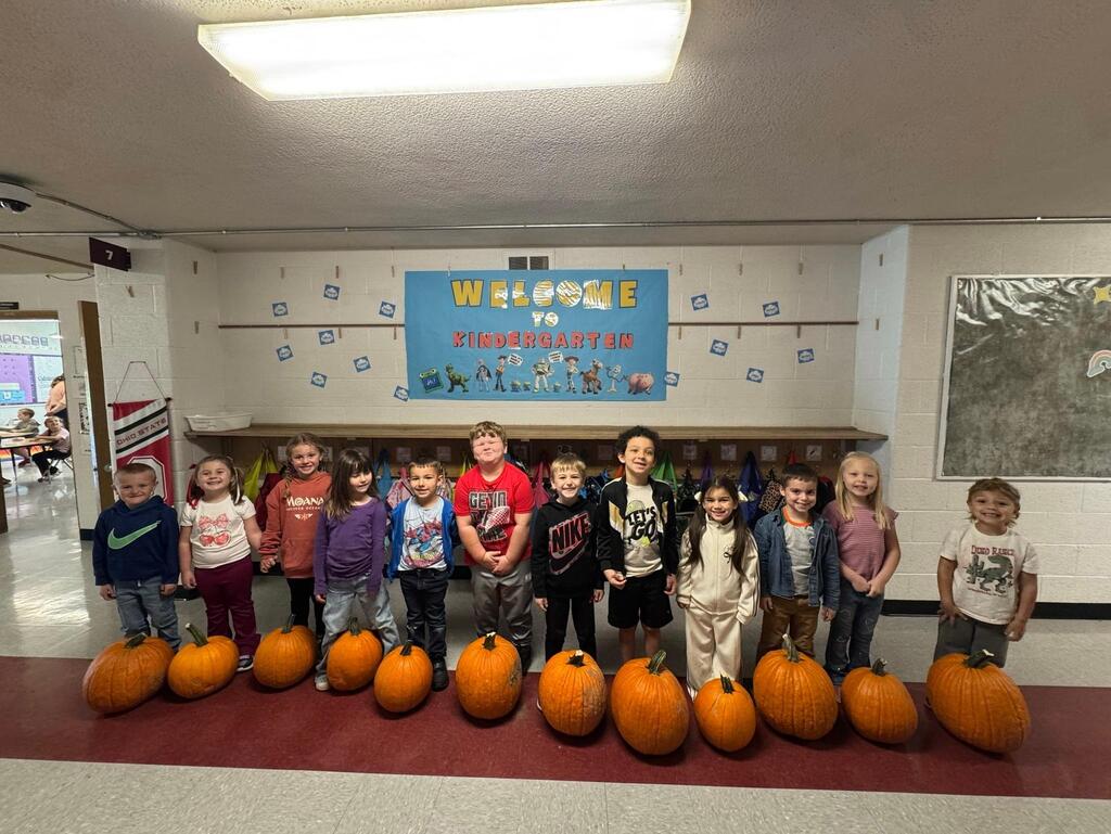 group of students standing with their pumpkins