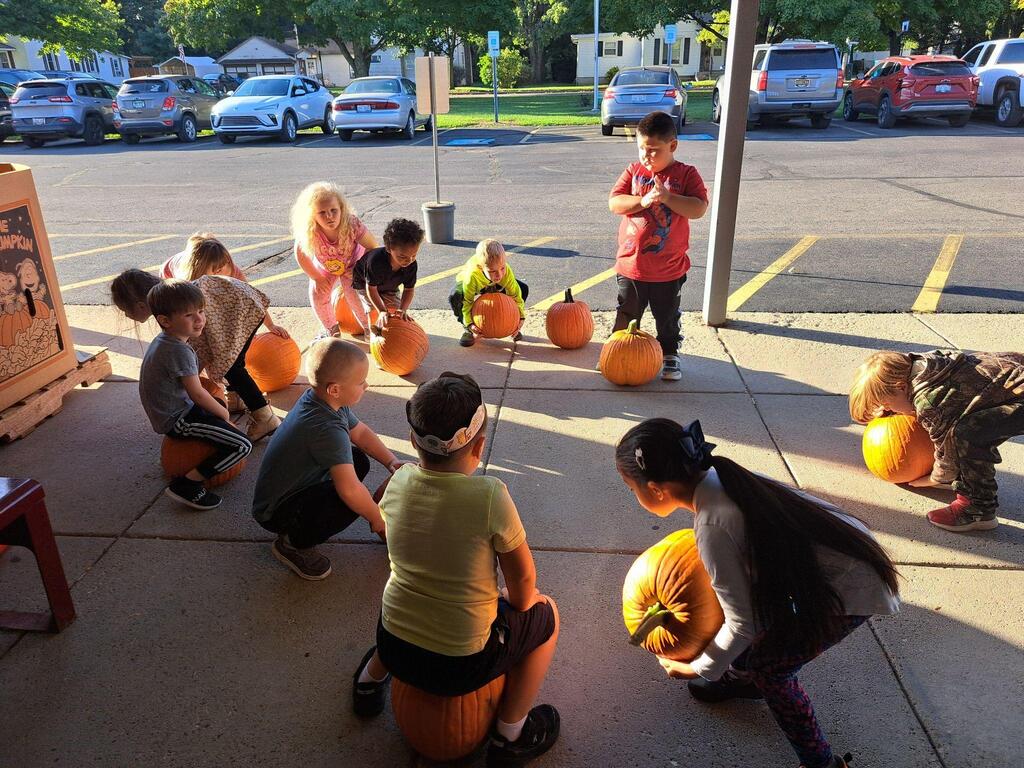 students with their pumpkins