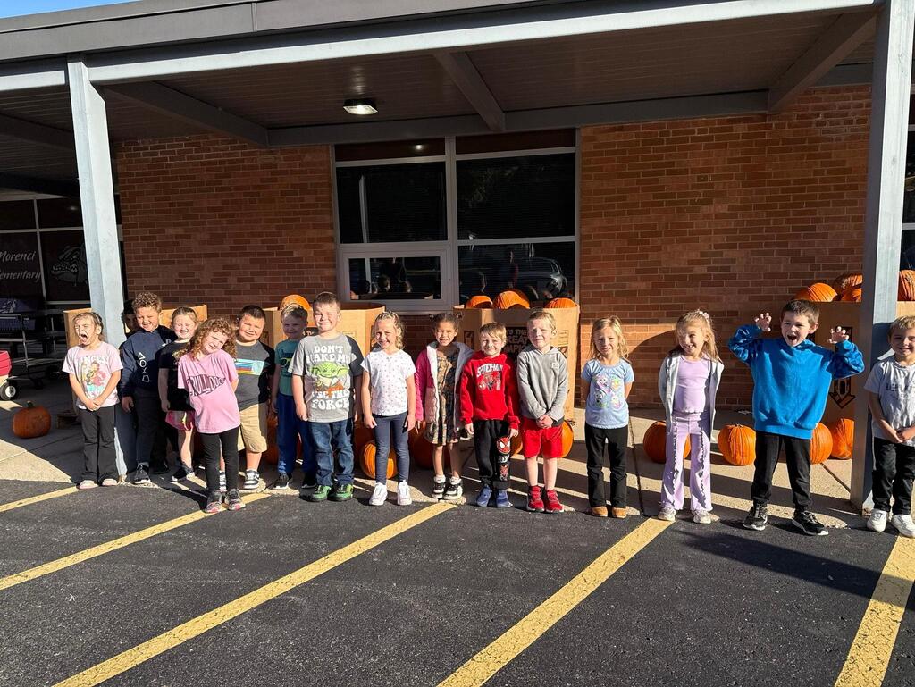 students in front of the pumpkins