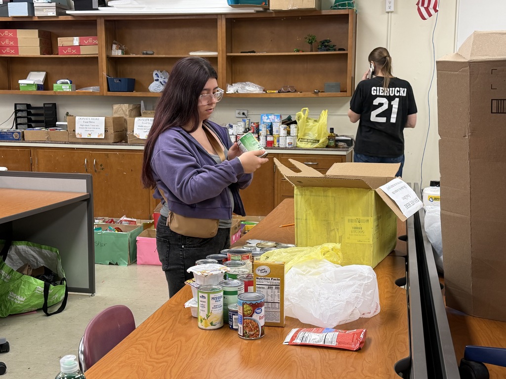 students sorting food boxes